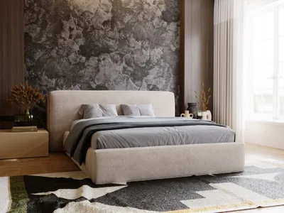 A bedroom scene with a bed, rug, and decorative elements.