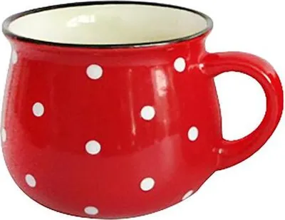 A red mug with white polka dots is shown against a white background.