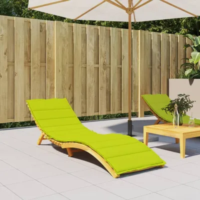 A patio scene with lounge chairs and a table.