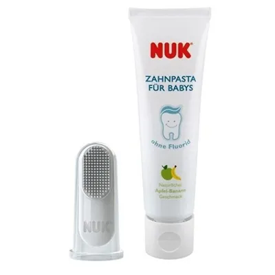 A NUK baby toothpaste tube and a finger toothbrush are displayed against a white background.
