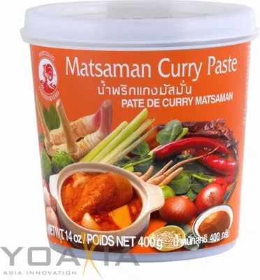 A tub of Matsaman Curry Paste with ingredients depicted on the label.