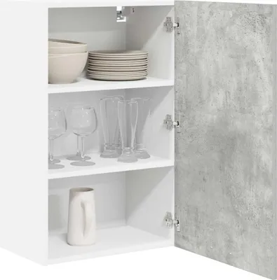 An open white cabinet with shelves displaying kitchenware, including bowls, plates, and glasses. The cabinet door has a concrete-like texture.