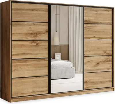 A wardrobe with sliding doors, one of which is a mirror, reflecting a bedroom interior.
