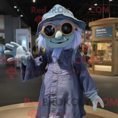Productafbeelding van Mascottekarakter REDBROKOLY van een heks gekleed met een Chambray-shirt en zonnebril