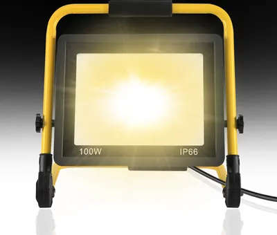 A bright LED work light with a yellow stand.