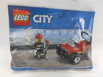 A sealed plastic bag containing a Lego City firefighter buggy set.