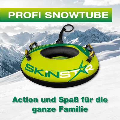 A snowtube on a snowy slope with mountains in the background.