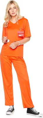 A woman is posing in a full-body shot, wearing a prisoner costume.