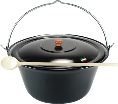 A black enameled cauldron with a lid and a wooden spoon resting on it, set against a white background.