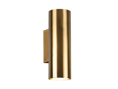 A brass-colored cylindrical wall light is shown against a white background.