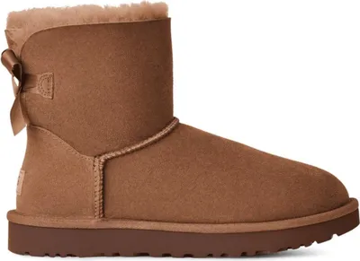 A single brown Ugg boot with a bow on the back, shown from the side against a white background.