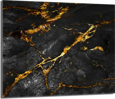 A close-up of a black marble surface with gold veins.