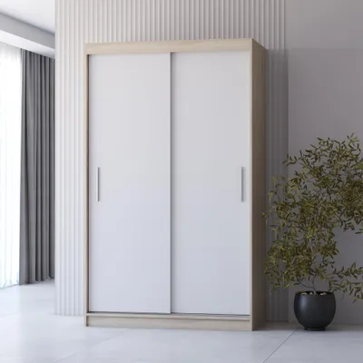 A modern sliding door wardrobe in a room with minimalist decor.