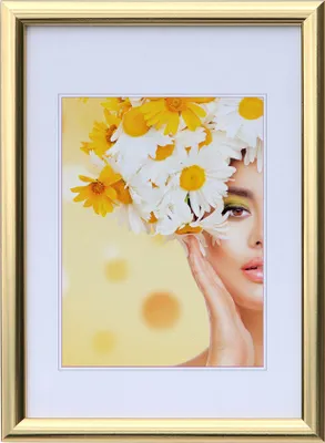 A framed portrait of a woman with flowers in her hair.