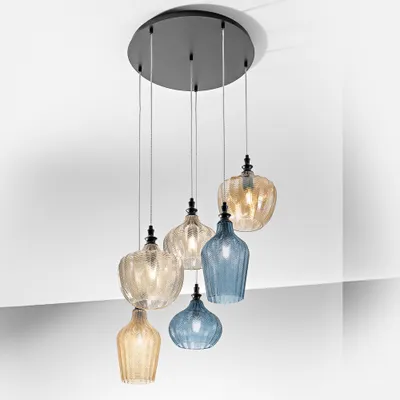 A chandelier with six glass pendants hanging from a circular black base attached to a white ceiling.