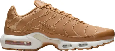 A side view of a single Nike Air Max Plus sneaker.