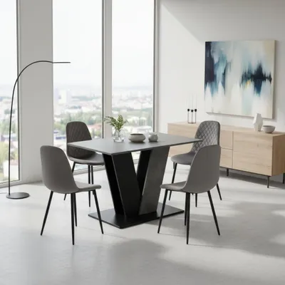 A dining set with a table and four chairs in a modern dining room with large windows.