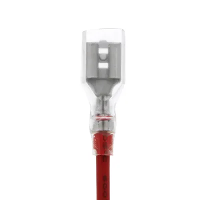 A close-up view of an electrical connector with a red wire.