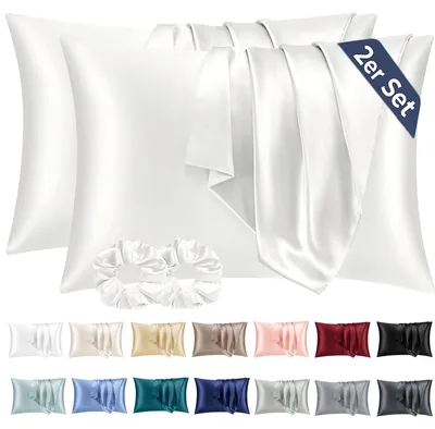 Produktbild von Set mit 2 Satin-Kissenbezügen, 40 x 80 cm, elfenbeinfarben, seidenweich und pflegeleichter als Seidenkissenbezüge. Inklusive 2 Haargummis.
