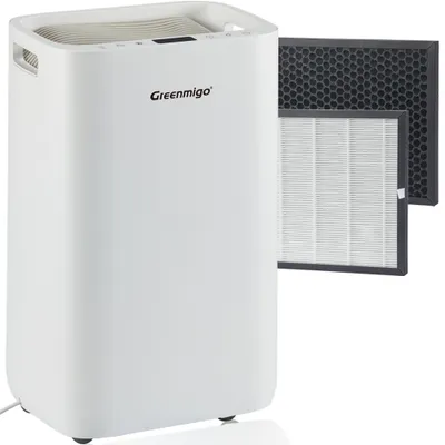 A white air purifier with two replacement filters shown next to it.