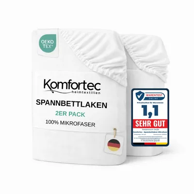 Two white fitted sheets are stacked and presented against a white background. A label with the OEKO-TEX logo is visible on the top left sheet. A "Warentest" award badge is on the right sheet. A small tag with the German flag is attached to the left sheet.