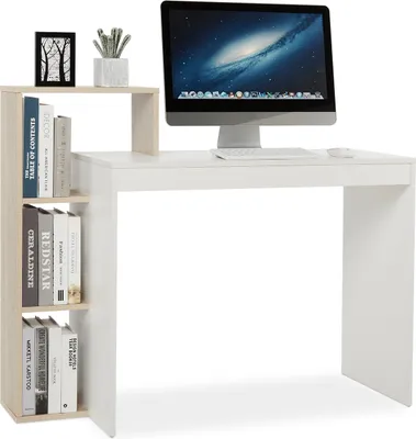 A white computer desk with a bookshelf on the left side, featuring a computer monitor, keyboard, and mouse on top.