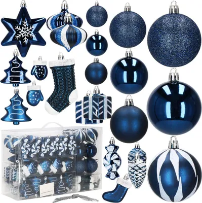A collection of dark blue and white Christmas ornaments are displayed against a white background.