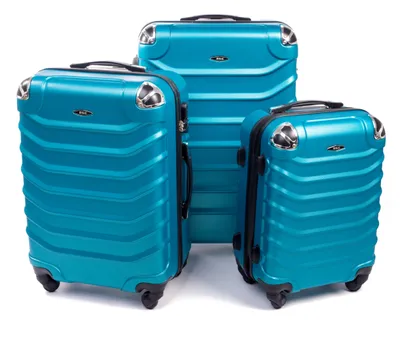 Three teal suitcases of varying sizes arranged on a white background.