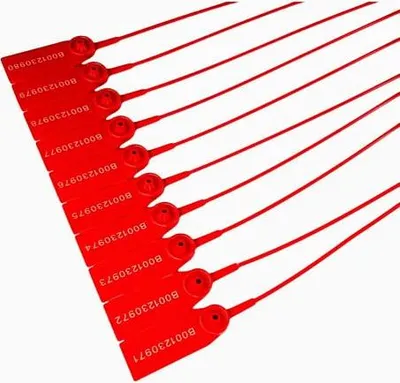 A group of red plastic security seals laid out diagonally on a white background.