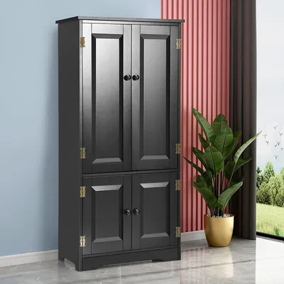 A dark gray tall cabinet with four doors stands against a backdrop of light blue and pink ribbed walls, with a green plant in a gold pot to the right and a window showing a landscape view.