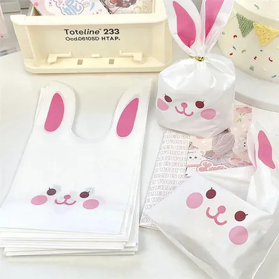 Produktbild von 100 Handout-Tüten – Ostertüten – Kaninchen – 13 x 22 cm – Leckerli-Geschenktüten aus Kunststoff – WeißPink – CandyCookieKekstüten – Ostern – Osterleckerli – 100 Stück – CHPN