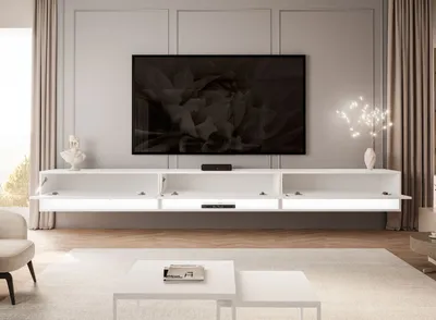 A modern living room with a wall-mounted TV and entertainment unit.