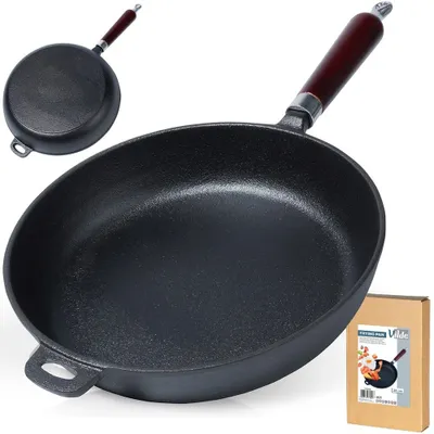 A cast iron frying pan with a wooden handle is shown, along with its packaging.