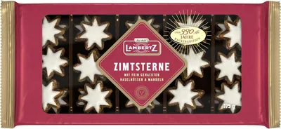 A package of Lambertz Zimtsterne cookies, shaped like stars and decorated with white icing.