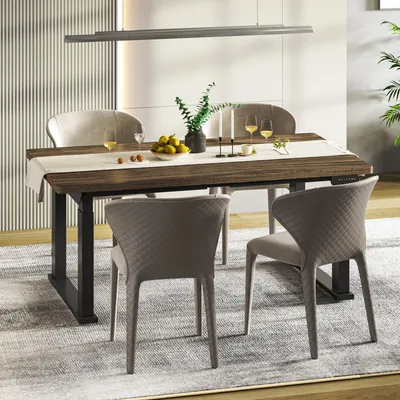 A dining table set up in a modern dining room with chairs, tableware, and decor.