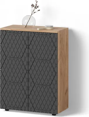 A mid-sized cabinet with a textured front and a wooden top, placed against a white wall.