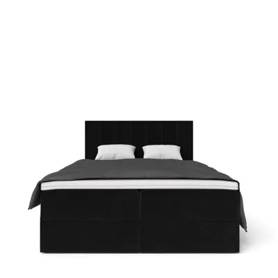 A black upholstered bed with two white pillows and a dark grey duvet, shown from the front on a white background.