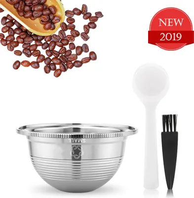 A compilation of coffee beans, a stainless steel coffee capsule, a white spoon, and a black brush, set against a white background. A red badge indicates 'NEW 2019'.