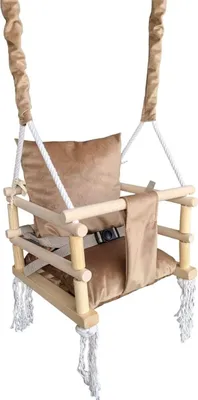 A baby swing made of wood and fabric, suspended by ropes.