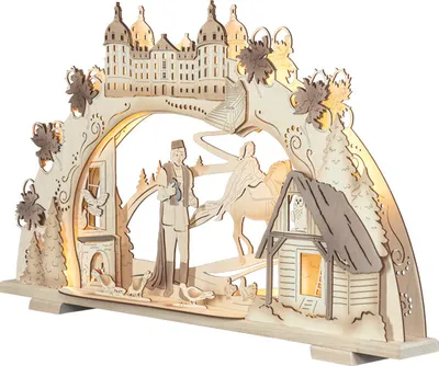 A wooden Christmas arch with a castle, figures, and a small house, illuminated by warm white LEDs.