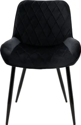 A black velvet dining chair with diamond tufting on the back and seat, supported by four thin black metal legs.