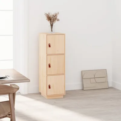 A tall, narrow wooden cabinet with three doors, each with a small brown leather handle, is shown in a room with light-colored walls and floor. A vase with dried flowers sits on top of the cabinet. A framed abstract artwork is leaning against the wall to th