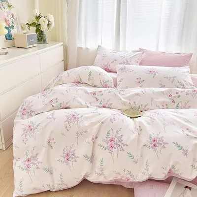Image de Ensemble de literie réversible Unyqoos® 135 x 200 cm, 100% coton – 1 housse de couette + 1 taie d'oreiller 80 x 80 cm, réversible avec motifs floraux et à carreaux roses, fermeture à fermeture éclair