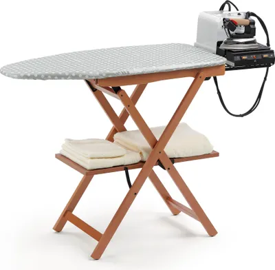 An ironing board with an iron and steam generator attached, set against a white background. There are folded towels on a shelf below the ironing board.