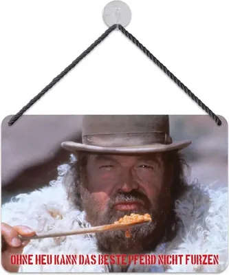 A man in a hat and fur coat is holding a spoon with food, with text below.