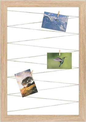 A wooden photo frame with strings and clothespins holding three photographs.