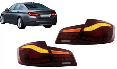 Immagine prodotto di Fari posteriori a LED per BMW Serie 5 F10, rossi e trasparenti, con indicatori di direzione dinamici.