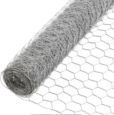 A roll of galvanized hexagonal wire mesh, also known as chicken wire, is shown diagonally against a white background. The mesh is tightly rolled, with the hexagonal pattern clearly visible on the unrolled portion.