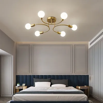 A modern bedroom with a ceiling light fixture above a bed.