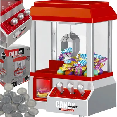 A mini candy grabber machine filled with colorful candies, shown with its packaging and coins.